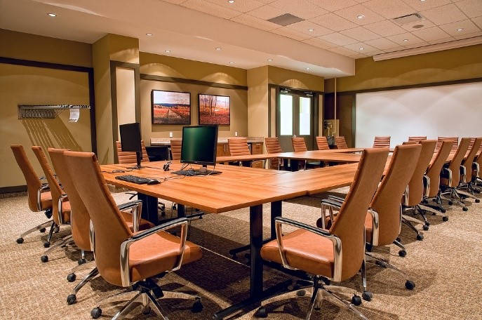 In-person-hearing-image An image of a meeting room with a number of chairs around a rectangle table