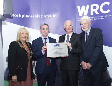WRC370 An image of 4 persons holding the plaque to commemorate the opening of the WRC Cork office